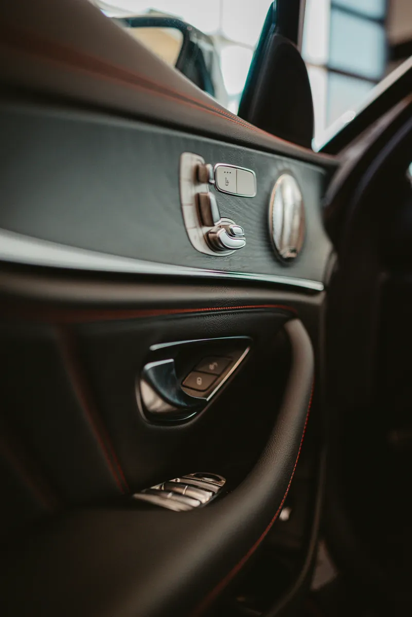 Seat controls on the leather door panel of the luxury van
