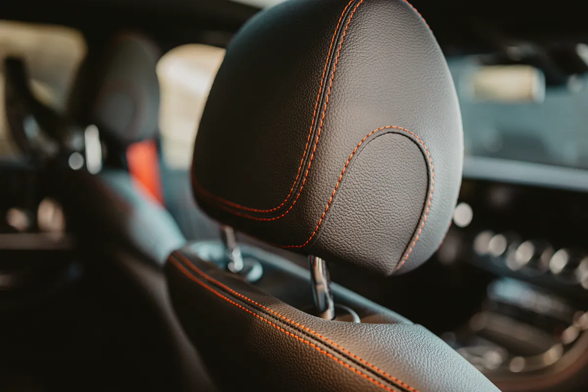 Leather headrest with contrast stitching of the luxury van